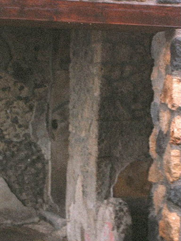 I.14.12 Pompeii. December 2004.   
Room 32, two doorways, to rooms 13, on left,  and room 34,on right,  on east side of peristyle, taken from I.14.13 

