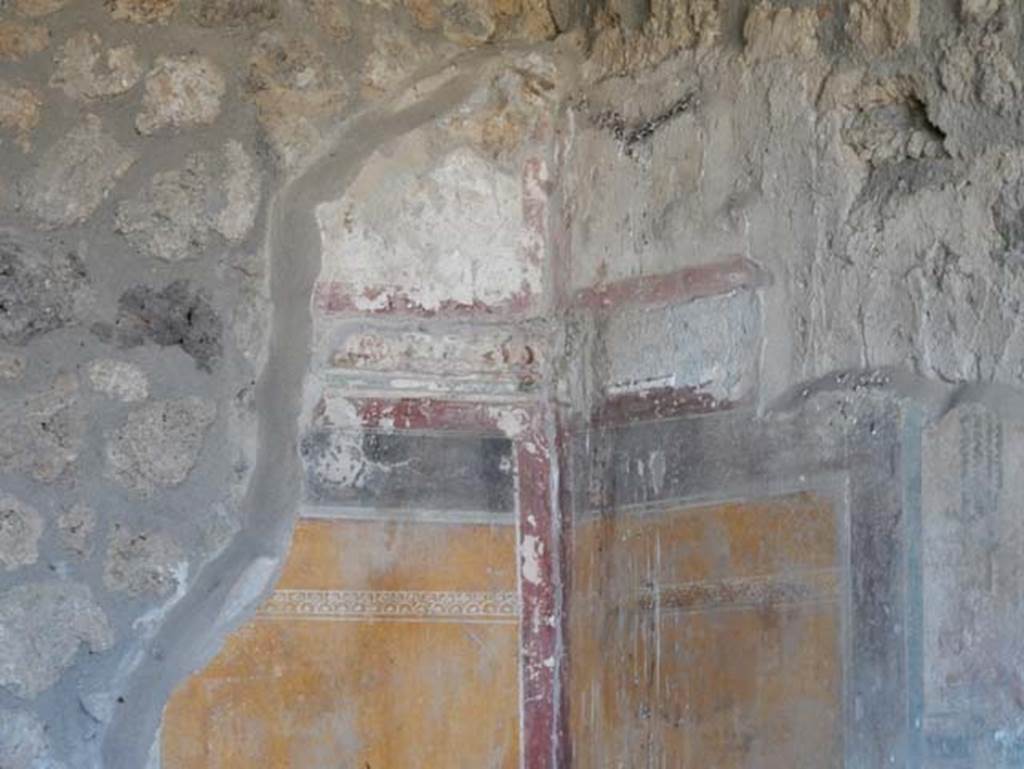 I.14.12, Pompeii. May 2018. Room 34, detail of painted decoration in upper south-east corner.
Photo courtesy of Buzz Ferebee.
