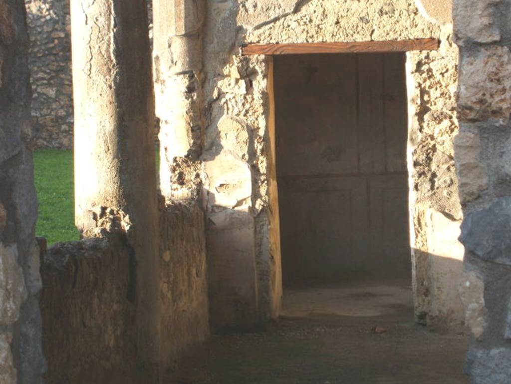 I.14.13 Pompeii. December 2004. Looking north into I.14.12 from entrance, with doorway to room 2.