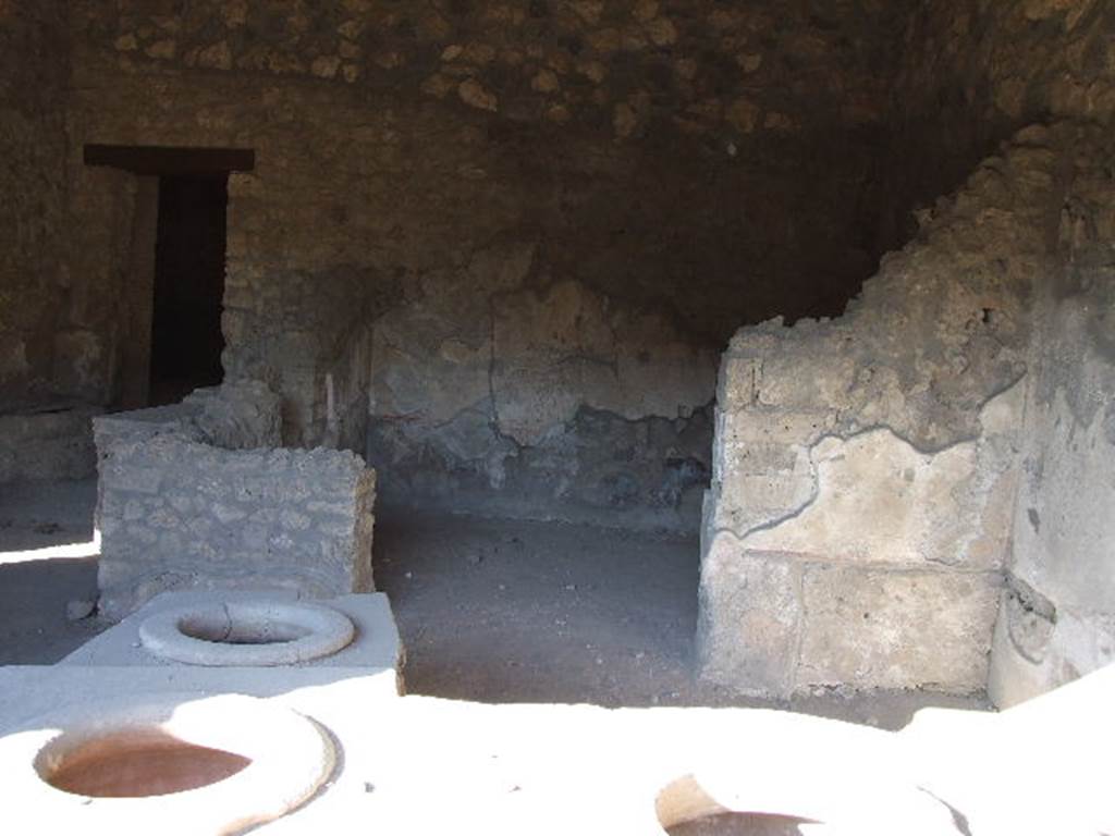 I.14.15 Pompeii. December 2006. Rear room behind counter, on east side of bar.