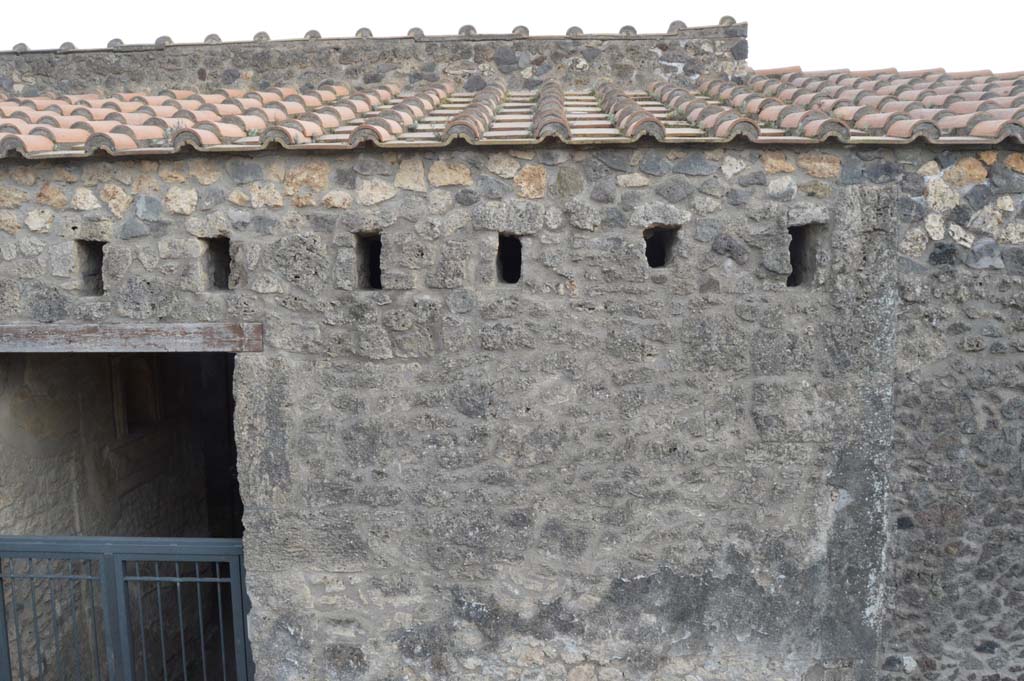 I.15.1 Pompeii. March 2019. 
Looking south to upper area of front façade on west side of the entrance doorway on Via di Castricio. 
Foto Taylor Lauritsen, ERC Grant 681269 DÉCOR.
