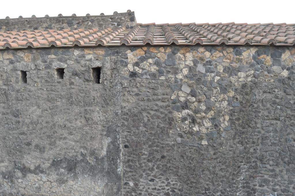 I.15.1 Pompeii. March 2019. 
Looking south to upper area of front façade on west side of the entrance doorway on Via di Castricio, and part of I.15.2/3. 
Foto Taylor Lauritsen, ERC Grant 681269 DÉCOR.
