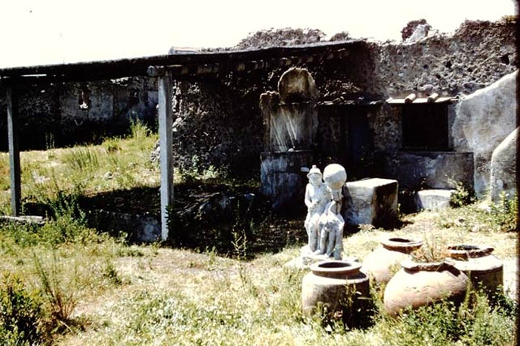 I.20.1 Pompeii. 1961. Looking north-west across garden to triclinium, statue and dolia.   Photo by Stanley A. Jashemski.
Source: The Wilhelmina and Stanley A. Jashemski archive in the University of Maryland Library, Special Collections (See collection page) and made available under the Creative Commons Attribution-Non Commercial License v.4. See Licence and use details.
J61f0472
