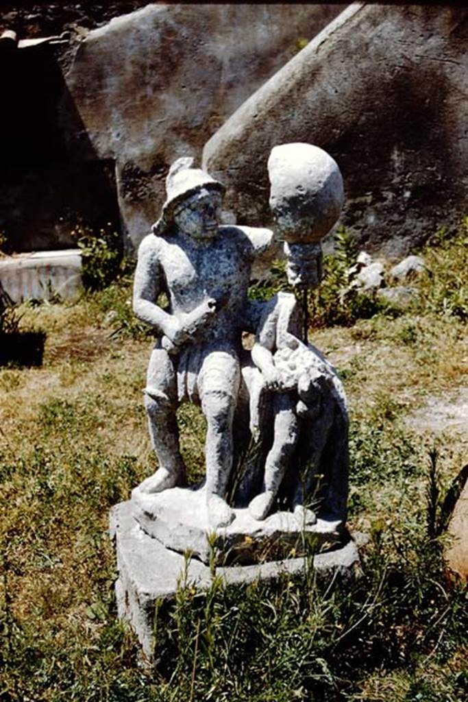 I.20.1 Pompeii. 1961. Statue of a gladiator, in situ on the base where it was found. At the rear are the stairs against the north wall. Photo by Stanley A. Jashemski.
Source: The Wilhelmina and Stanley A. Jashemski archive in the University of Maryland Library, Special Collections (See collection page) and made available under the Creative Commons Attribution-Non Commercial License v.4. See Licence and use details.
J61f0470
