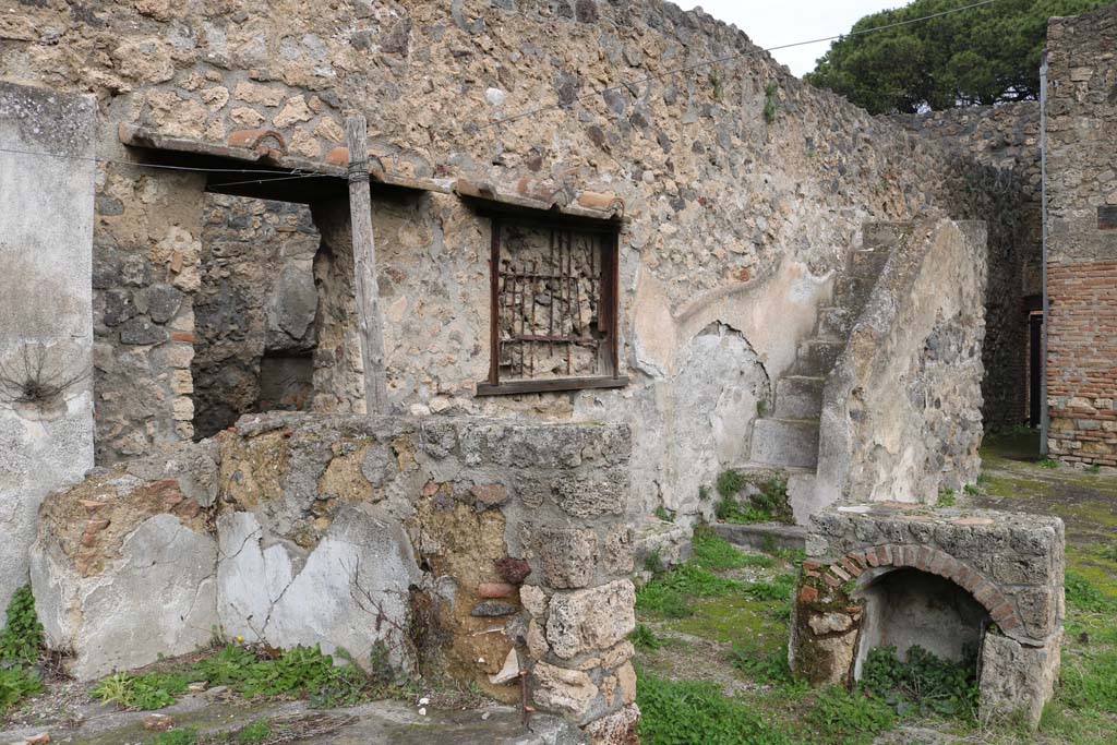 I.20.1 Pompeii. December 2018. Looking east across triclinium, with stairs to upper floor, at rear. Photo courtesy of Aude Durand.