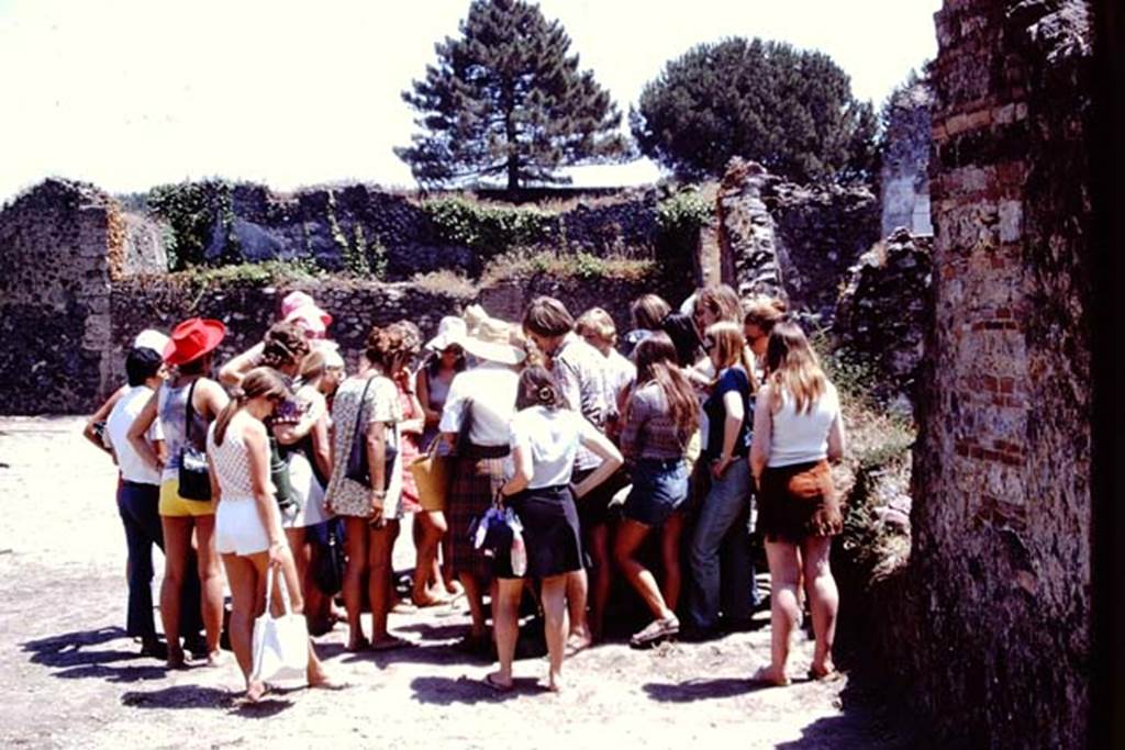 I.20.5 Pompeii. 1972. Examining site of root cavities in south-east corner. Photo by Stanley A. Jashemski. 
Source: The Wilhelmina and Stanley A. Jashemski archive in the University of Maryland Library, Special Collections (See collection page) and made available under the Creative Commons Attribution-Non Commercial License v.4. See Licence and use details. J72f0190
