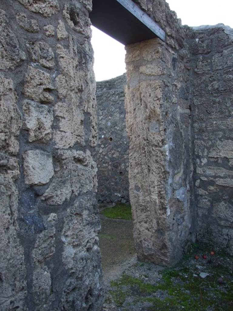 II.1.2 Pompeii. December 2007. Small cubiculum, south wall with doorway leading to atrium.