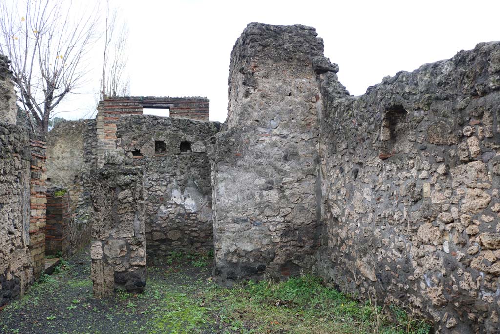 II.1.3 Pompeii. December 2018. 
Looking south across atrium towards cubiculum in south-west corner, and west wall of atrium. Photo courtesy of Aude Durand.

