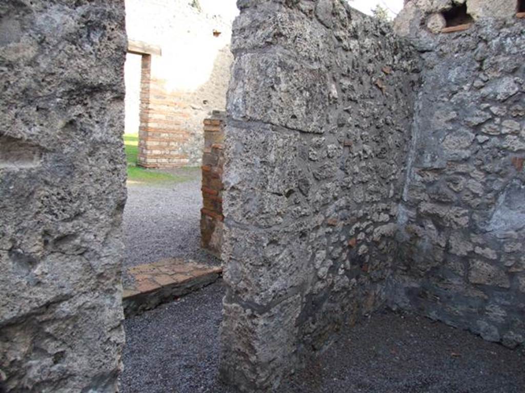 II.1.3.  Small cubiculum.  East wall looking through doorway into corridor and doorway to II.1.4.