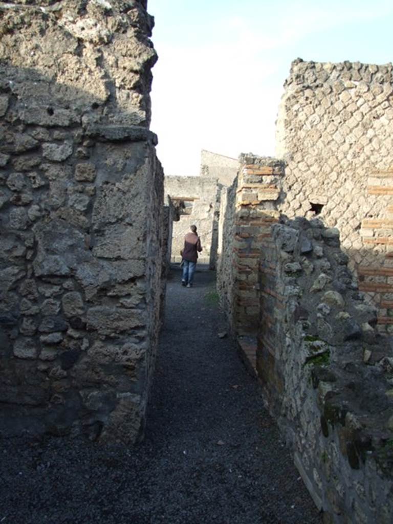 II.1.3.  Corridor looking north towards entrance from rear room.  The door on the right in the corridor leads to II.1.4.