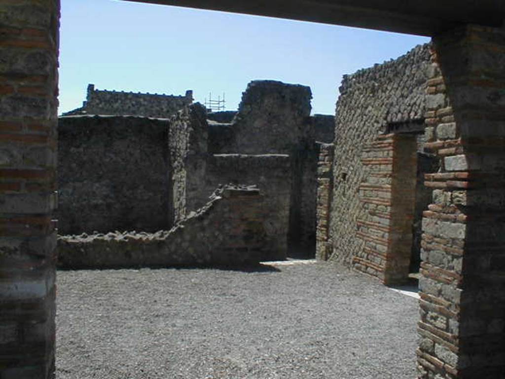 II.1.3. Looking west from II.1.4 towards rear room and corridor.