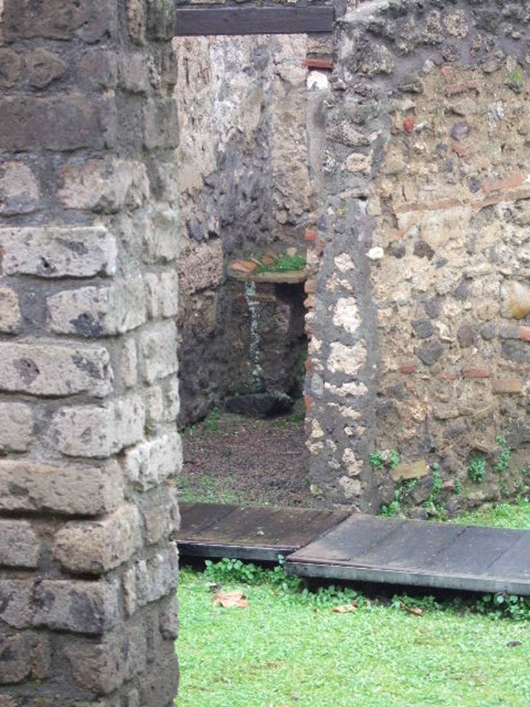 II.1.8 Pompeii. December 2005. Looking north-west to doorway to latrine.