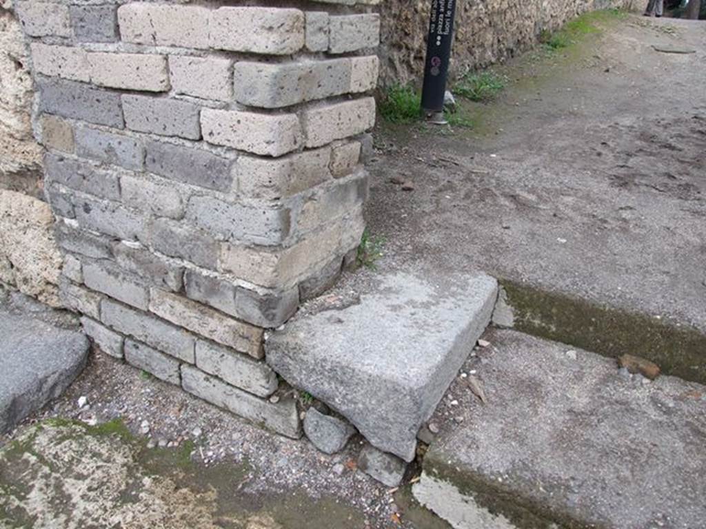 II.1.9 Pompeii.  December 2006. Base of north side of portal, originally used for crowd control to Amphitheatre.    