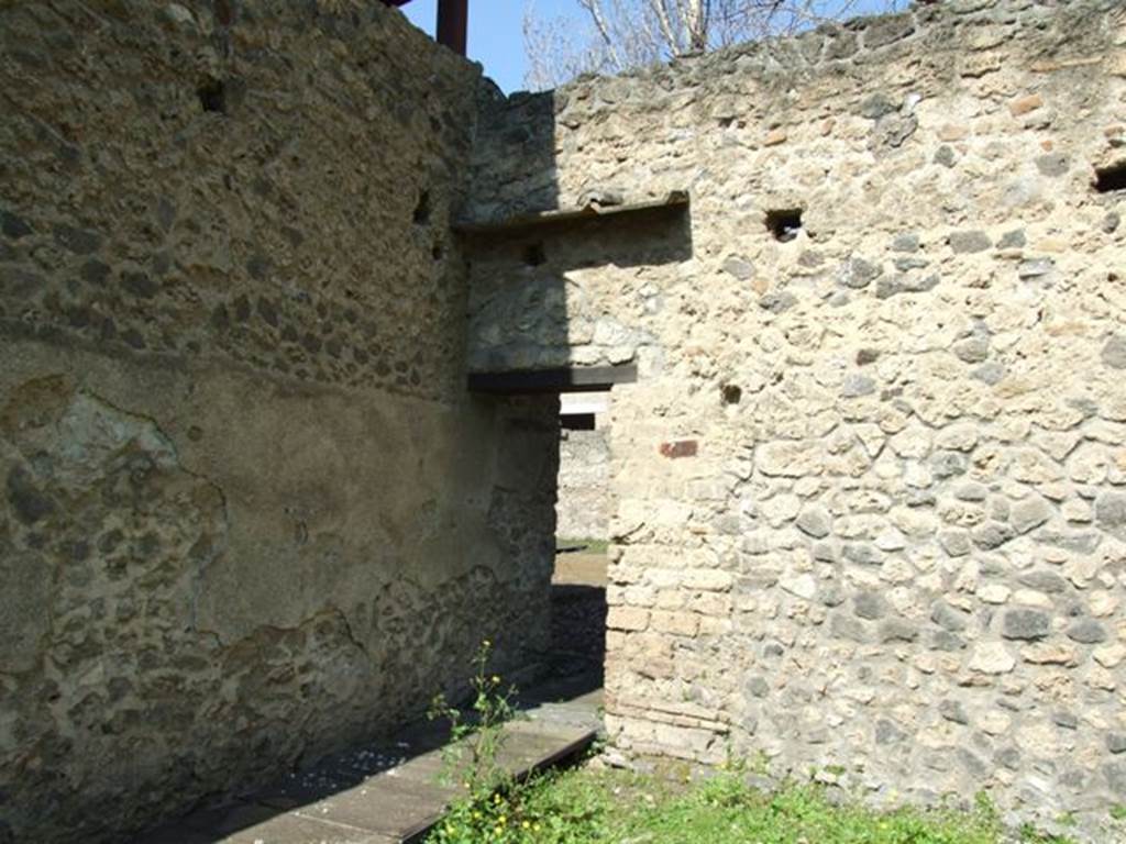 II.1.11 Pompeii. March 2009. North wall of garden area, and doorway to peristyle area of II.1.12.