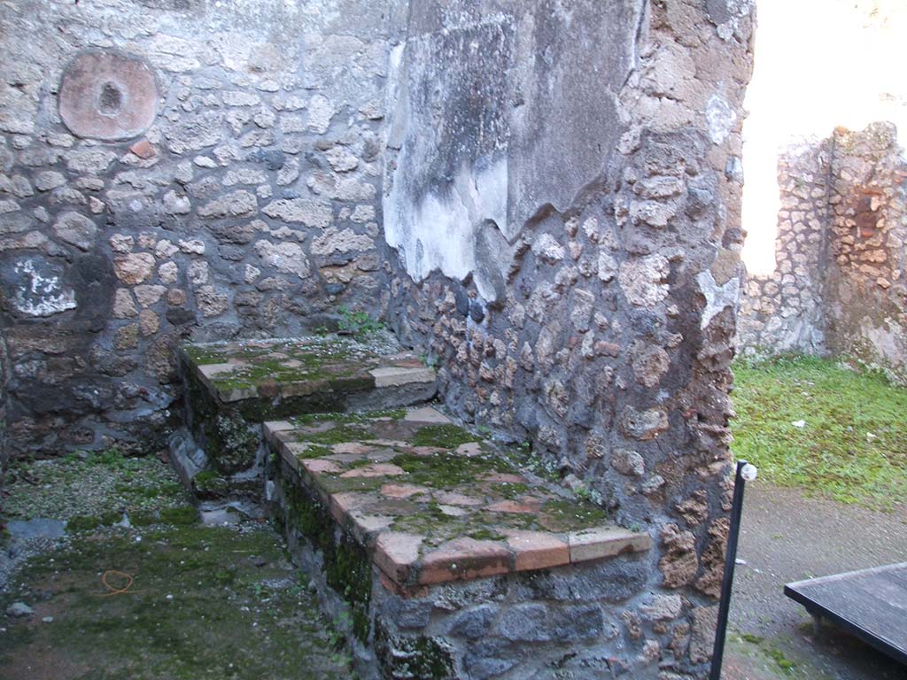 II.1.13 Pompeii. December 2004. Looking east across kitchen, taken through window in west wall to north of entrance.