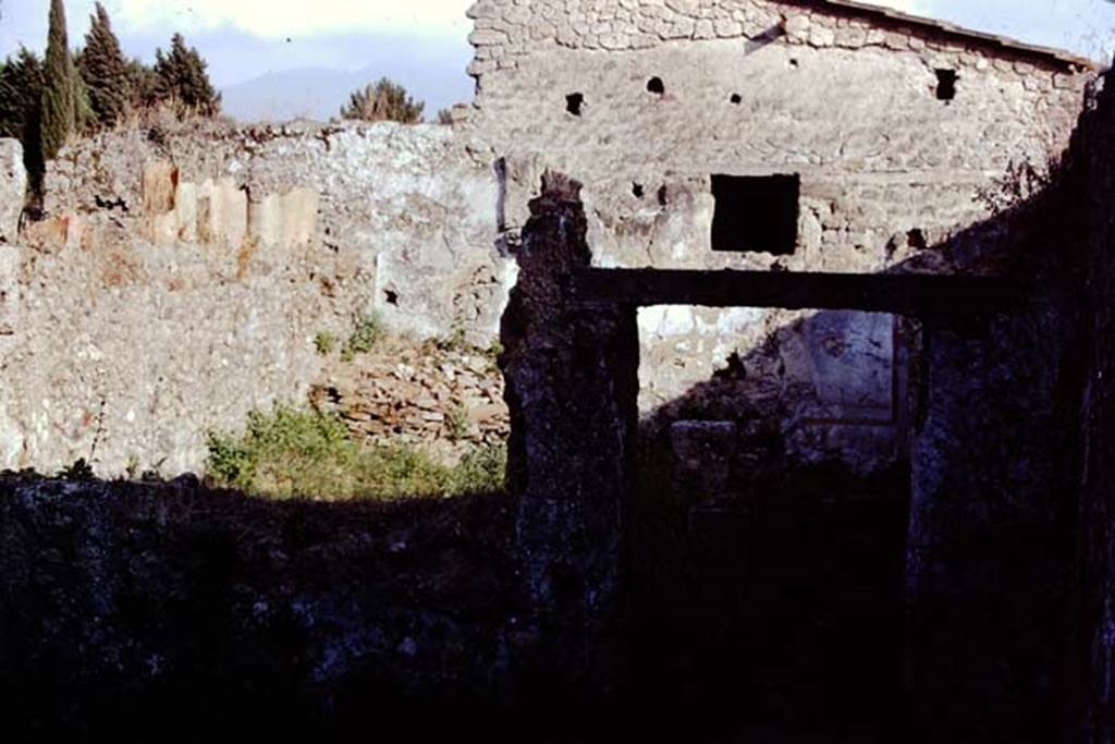 II.1.1/13 Pompeii. 1972. Looking south across window and doorway towards garden area, on left.  Photo by Stanley A. Jashemski. 
Source: The Wilhelmina and Stanley A. Jashemski archive in the University of Maryland Library, Special Collections (See collection page) and made available under the Creative Commons Attribution-Non Commercial License v.4. See Licence and use details.
J72f0207

