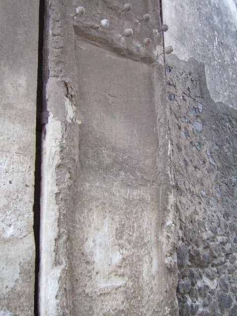 II.2.2 Pompeii. May 2016. East side of entrance doorway, with plaster cast of the shutters of the entrance doorway. 
Photo courtesy of Buzz Ferebee.

