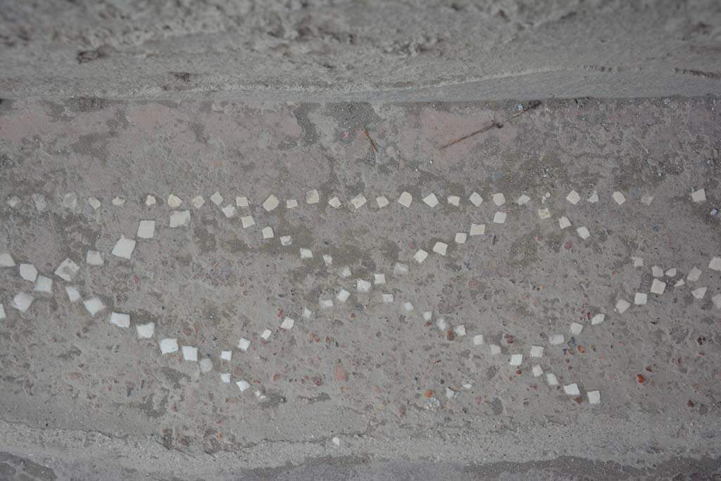 II.2.2 Pompeii. June 2012. 
Floor of entrance corridor 1, with remains of pattern with net design in small white stones. 
Photo courtesy of Michael Binns.
