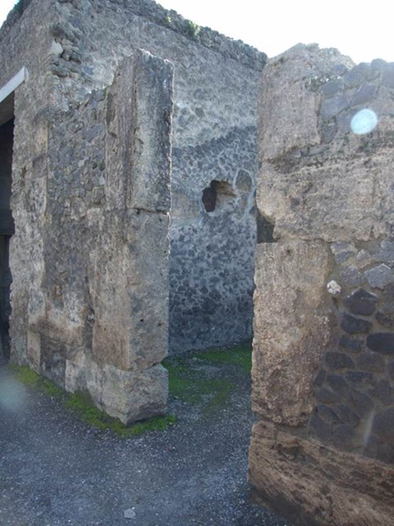 II.2.2 Pompeii. March 2009. Doorway to room 3, cubiculum on west side of atrium. As a result of the bombing of 19th September 1943, nearly all of the IV Style decoration of the central cubiculum was lost. The decoration from the north and west wall, and part of the south wall, were destroyed. In this cubiculum badly damaged were two figured paintings. One of a female, possibly of the wife or daughter of  Loreius, according to Della Corte. The other was the The rape of Europa, only partially damaged and restored. See Garcia y Garcia, L., 2006. Danni di guerra a Pompei. Rome: L’Erma di Bretschneider. (p.45-47)
