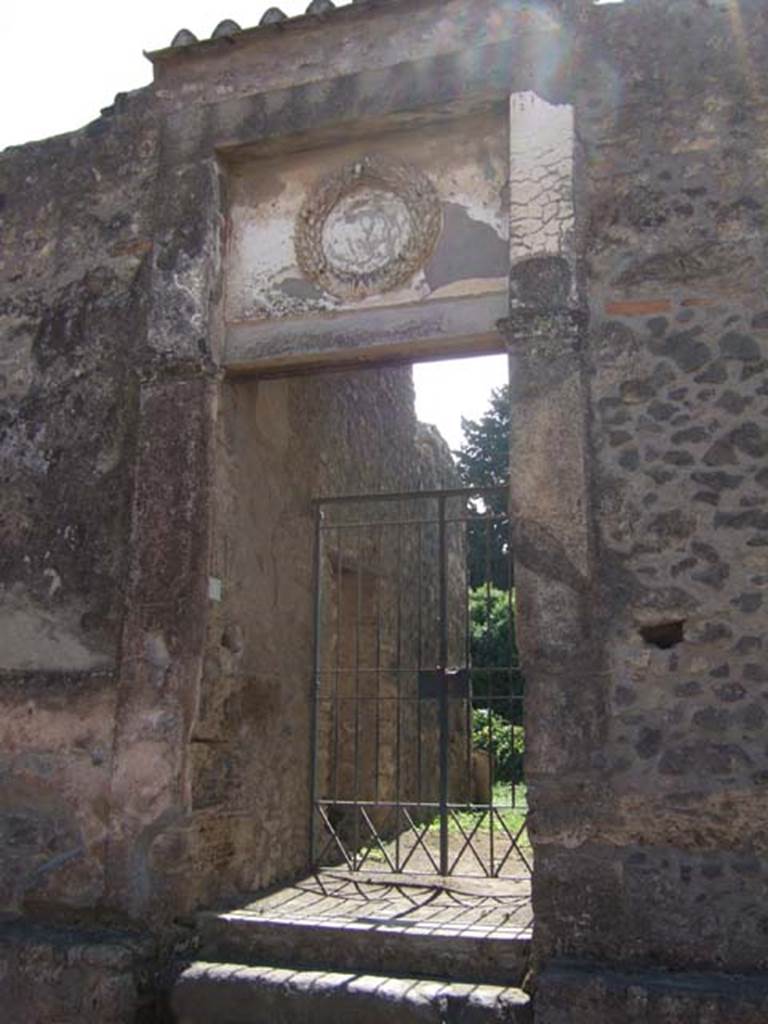 II.2.4 Pompeii. May 2016. Looking south from entrance corridor 1 and 2 to north portico and peristyle garden 4.
The roofing at the bottom is the upper euripus and biclinium of II.2.2 which shares a common wall with the narrow rear garden 10 of II.2.4.
Photo courtesy of Buzz Ferebee.


