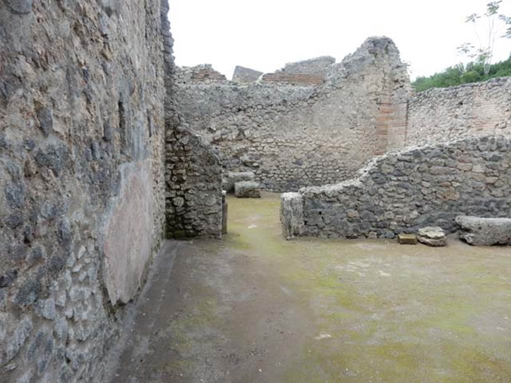 II.3.2 Pompeii. May 2016. Looking west across workshop towards doorway to rooms on west side. Photo courtesy of Buzz Ferebee. 
