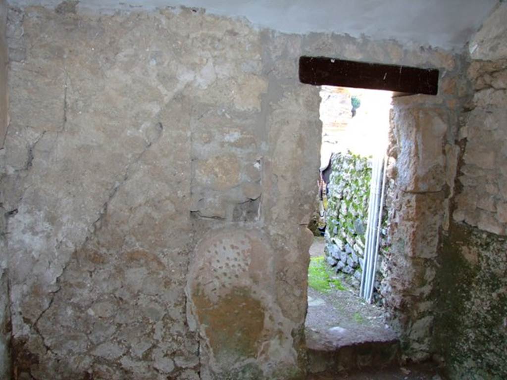 II.3.2 Pompeii. March 2009.  North wall with doorway to Yard.