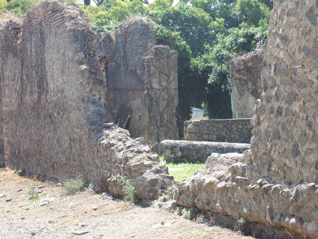 II.3.4 Pompeii. September 2005. Hole in wall of II.3.4 in side roadway, leading into east side of atrium.Looking south.