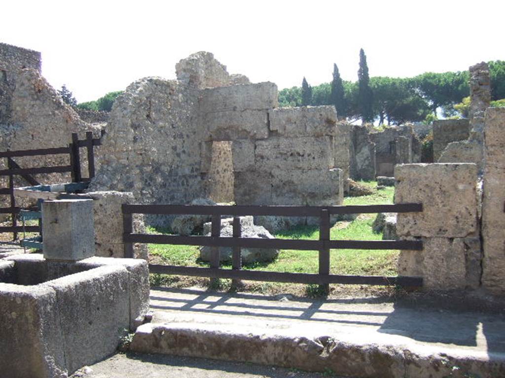 II.3.5 Pompeii. September 2005. Entrance doorway.
According to Pagano and Prisciandaro, in August and September 1756, many electoral recommendations were found here.
On the north-east corner of the insula (left of photo) east of doorway, were found CIL IV 1153-1159.
These were cut from the wall, and are now in the Naples Archaeological Museum. Some of them have now faded and are no longer readable.

Graffiti found September 1756, (PAH I, 1, 44, add. 96, dated 18th September 1756) -

[3] Rufum aed(ilem) o(ro) v(os) f(aciatis)       [CIL IV 1155]

Q(uintum) Postumium
Modestum quinq(uennalem) o(ro) v(os) f(aciatis)      [CIL IV 1156]

L(ucium) Ceium Secundum IIvir(um)
O(ro) v(os) f(aciatis) Papilio rog(at)       [CIL IV 1157]

Found September 1756, (PAH I, 1, 44, dated 25th September 1756) - 

P(ublium) Paquium et A(ulum) Vettium d(uumviros) i(ure) d(icundo) o(ro) v(os) f(aciatis) [[scr(ipsit)]]    [CIL IV 1158]

L(ucium) Popidium Secundum aed(ilem) d(ignum) r(ei) p(ublicae) o(ro) v(os) f(aciatis)
[3]ro[     [CIL IV 1159]

In October 1756, another two were found (PAH I, 1, 44, add. 96, dated 9th October 1756),

Modestum
quinq(uennalem) o(ro) v(os) f(aciatis)
d(ignum) r(ei) p(ublicae)
Ovidiumrei    [CIL IV 1160]

O() Secundum e istive o(ro) v(os) f(aciatis)    [CIL IV 1161]

See Epigraphik-Datenbank Clauss/Slaby (www.manfredclauss.de).
See Pagano, M. and Prisciandaro, R., 2006. Studio sulle provenienze degli oggetti rinvenuti negli scavi borbonici del regno di Napoli. Naples: Nicola Longobardi.  (p.23)

