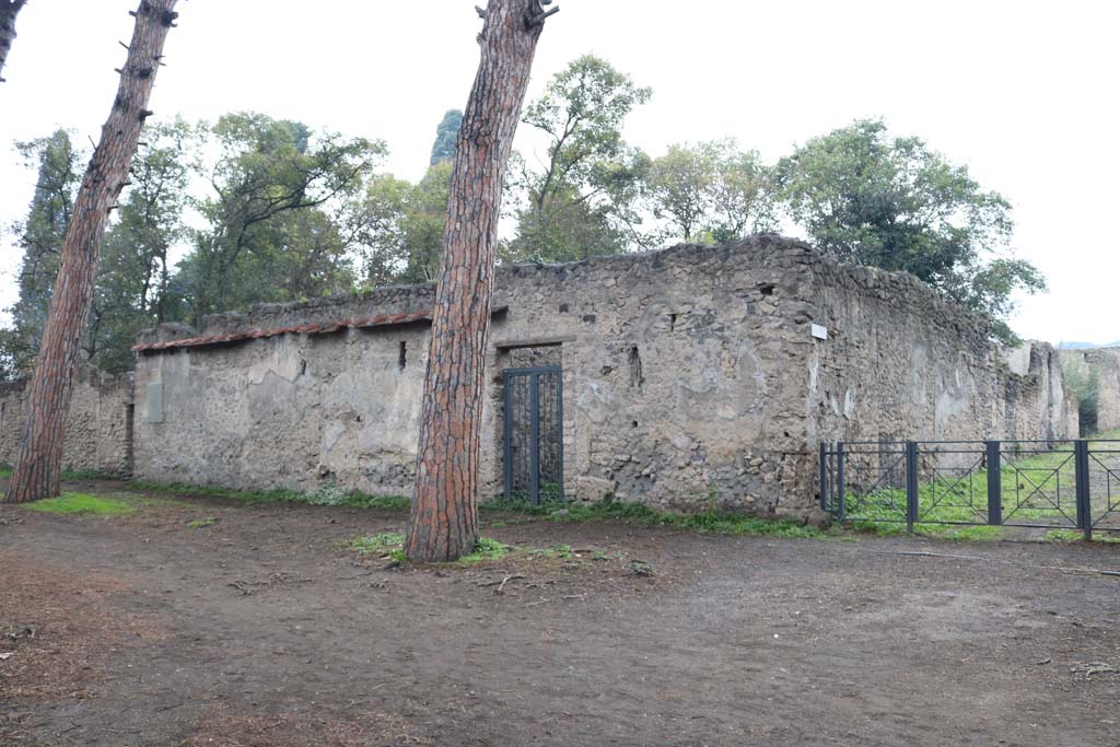 II.3.9, on left, and II.3.8, in centre, Pompeii. December 2018. 
Entrance doorways on north side of Via di Castricio. Photo courtesy of Aude Durand.
