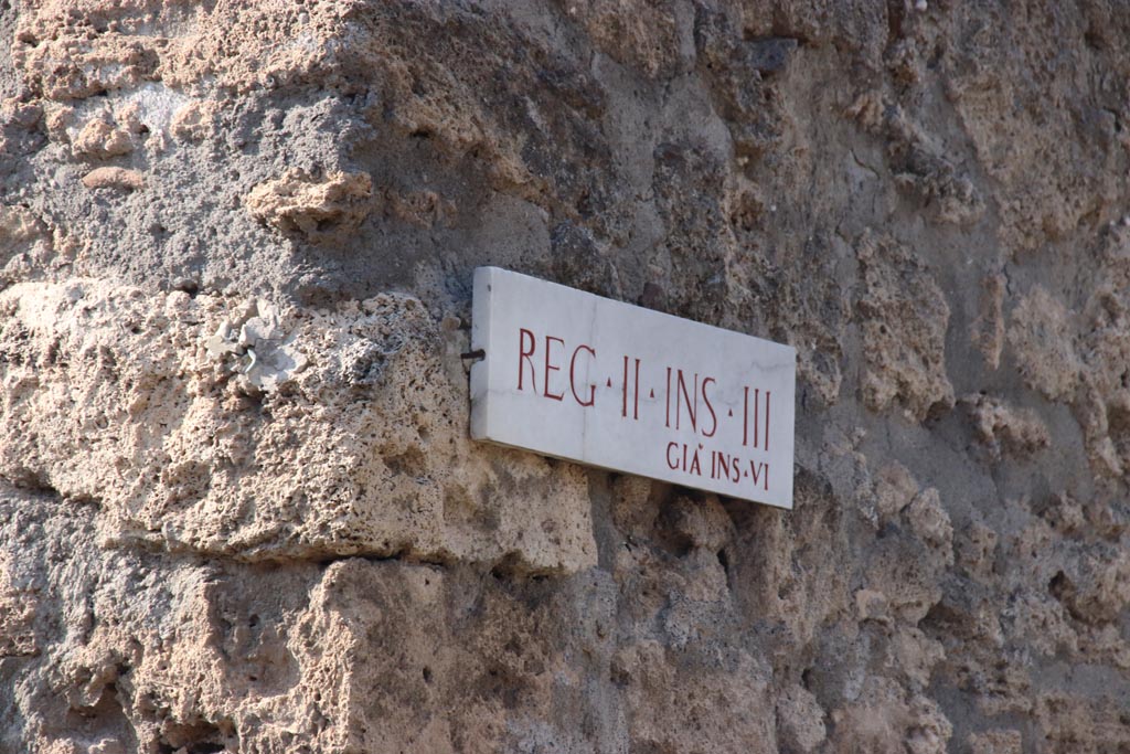 II.3.8, Pompeii. October 2023. Insula identification plaque originally known as II.6. Photo courtesy of Klaus Heese.