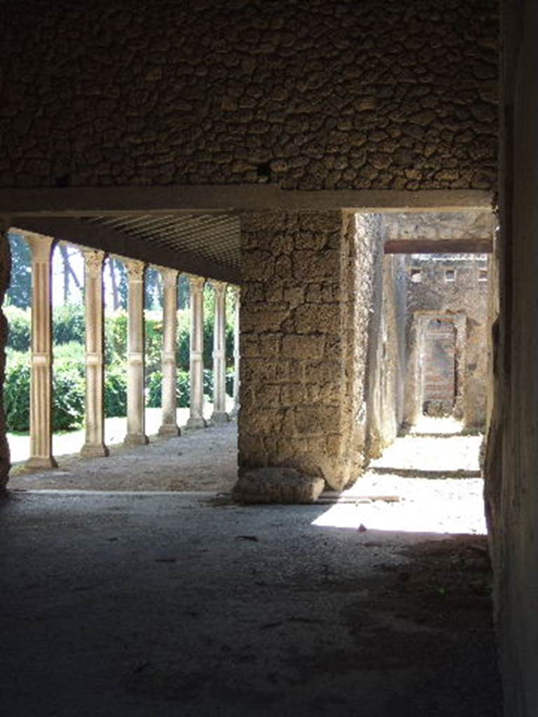 II.4.2 Pompeii. September 2005. Looking south from doorway which would have led to the steps to upper floor, linked to II.4.3.   
