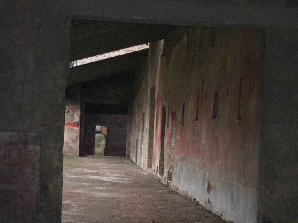 II.4.3 Pompeii. December 2006. West portico, looking south along west wall.
