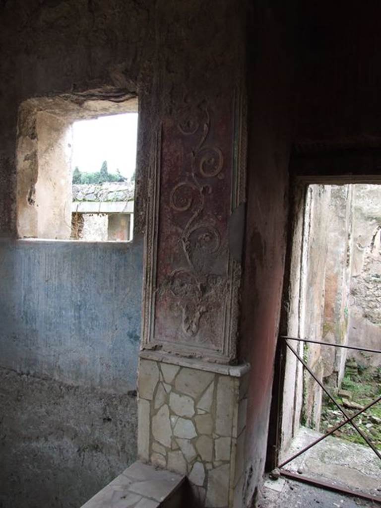 II.4.6 Pompeii. December 2006.  Frigidarium/apodyterium, detail of west side, and doorway to tepidarium or warm bath-room with remains of a black and white mosaic threshold.

