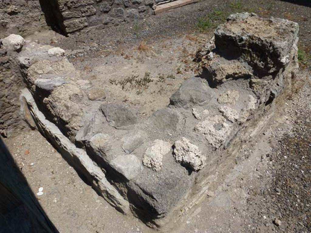 II.4.5 Pompeii. June 2012. Remains of podium/bench, looking from north-west corner.
Photo courtesy of Michael Binns.
