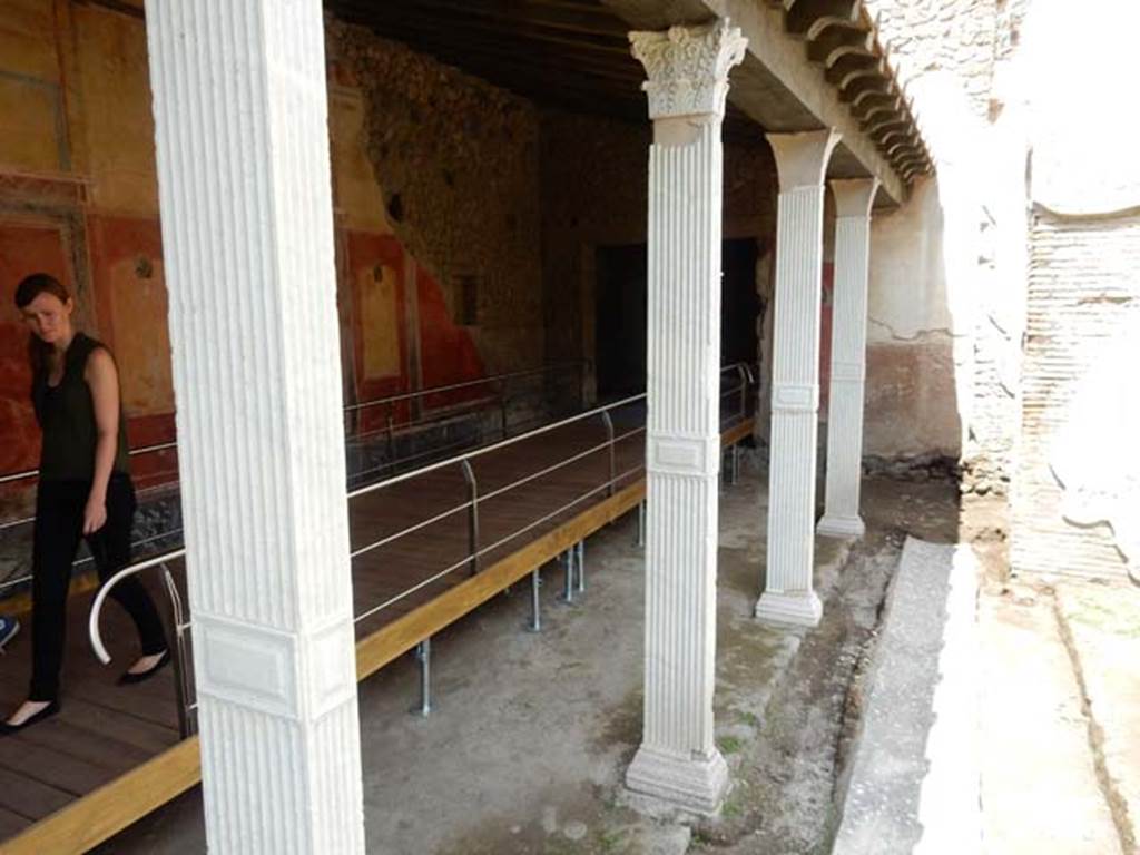 II.4.6 Pompeii. May 2016. Looking north-west towards north end of west portico and doorway into II.4.2/3. 
Photo courtesy of Buzz Ferebee.

