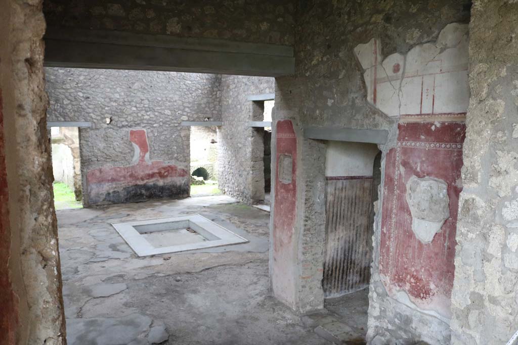 II.4.6 Pompeii. December 2018. 
Looking south into atrium of II.4.10, from top of steps at south end of portico. Photo courtesy of Aude Durand.
