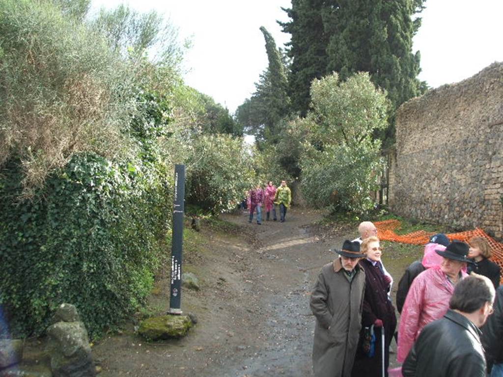 Pompeii. December 2004.  Vicolo dellAnfiteatro looking south towards II.4.8, on right.

