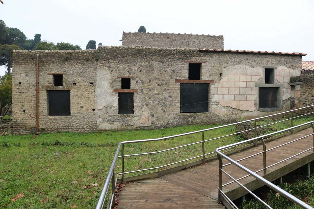 II.4.9 Pompeii. December 2018. 
Looking towards rooms on west side of garden which can be seen at II.4.10. Photo courtesy of Aude Durand.

