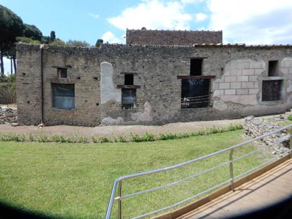 II.4.9 Pompeii. May 2016. Looking north across garden area. Photo courtesy of Buzz Ferebee.  According to the information board –  “The large park behind the house was planted as an orchard.  Soon after being excavated by Amedeo Maiuri, it was replanted and has now been re-arranged by retaining the same scheme of four large spaces surrounded by gravel paths and edged with hose-tongue lilies.  The spaces have been replanted with the existing fruit trees, replaced wherever necessary: pomegranate, quince, pear and cherry trees.  Along the perimeter grow trees and decorative shrubs such as cypresses, viburnum and oleanders.”
