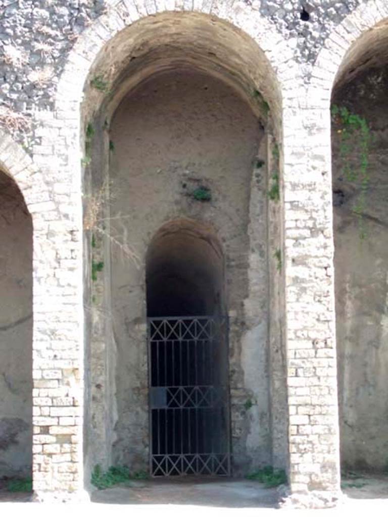 II.6 Pompeii. September 2005. Amphitheatre, entrance doorway under central staircase.
The “death gate” on the west side of the arena, reserved for the bodies of the dead, would lead to this entrance.
See Mau, A., 1907, translated by Kelsey, F. W., Pompeii: Its Life and Art. New York: Macmillan. (p. 215).
