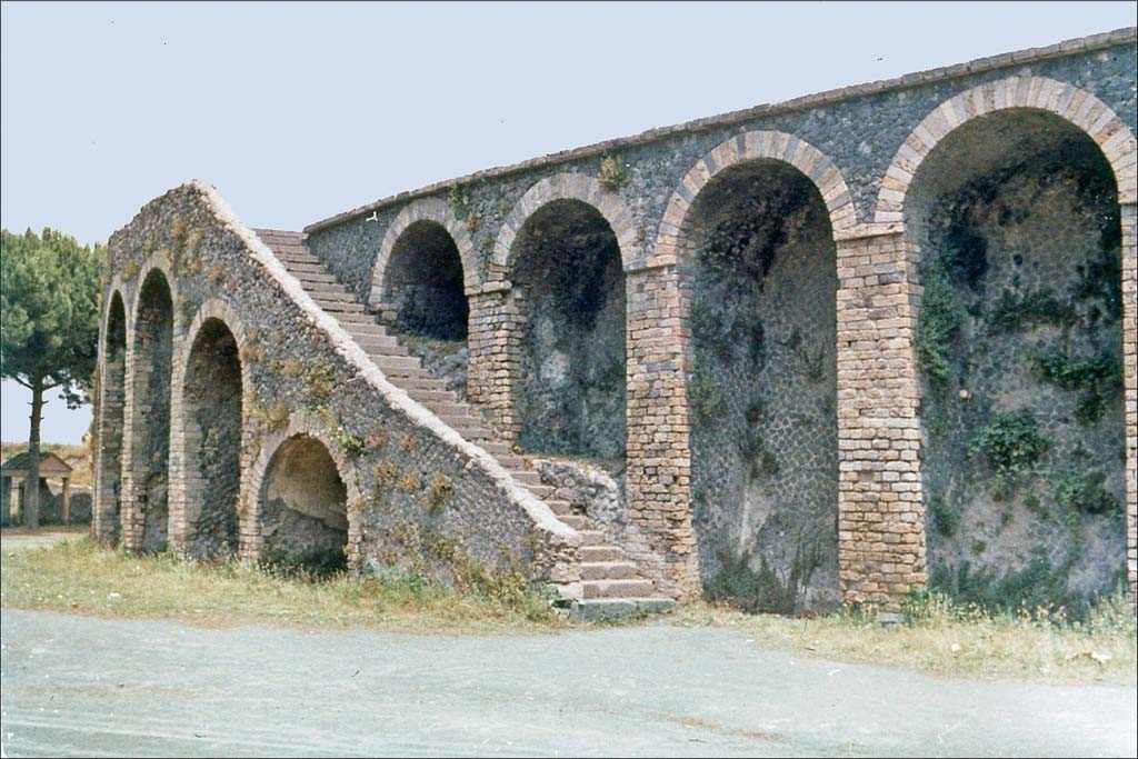 II.6 Pompeii. June 1962. Amphitheatre, looking towards south side of north-west double staircase.
Photo by Brian Philp: Pictorial Colour Slides, forwarded by Peter Woods
(P43.8 POMPEII external stairs to upper tiers Amphitheatre)
