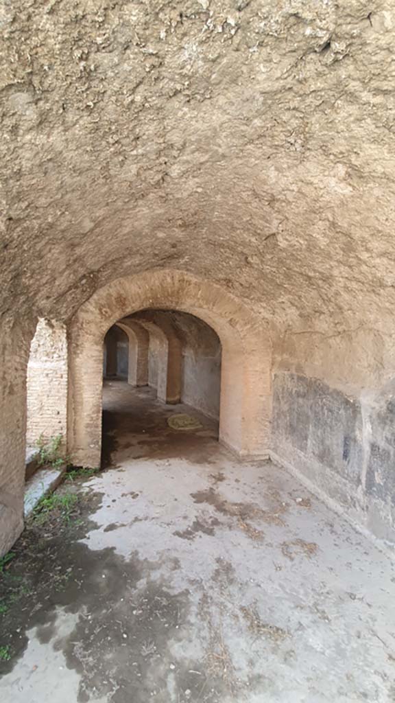 II.6 Pompeii. October 2022. 
West corridor under Amphitheatre, looking south-west from north entrance corridor. Photo courtesy of Klaus Heese
