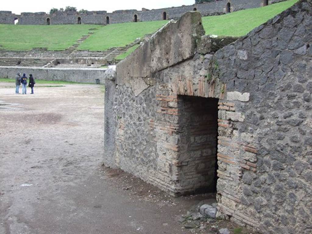 II.6 Pompeii. December 2006. Doorway under Amphitheatre, on west side of entrance corridor from north.According to Mau, there are three of these small dark rooms, near the end of the three corridors. Their purpose was unknown, but they may have been storerooms. See Mau, A., 1907, translated by Kelsey, F. W., Pompeii: Its Life and Art. New York: Macmillan. (p. 215-6).
