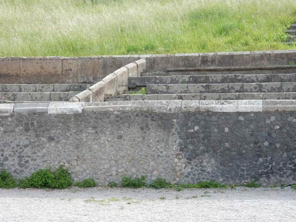 II.6 Pompeii, May 2018. Detail of seating on east side of amphitheatre. Photo courtesy of Buzz Ferebee.