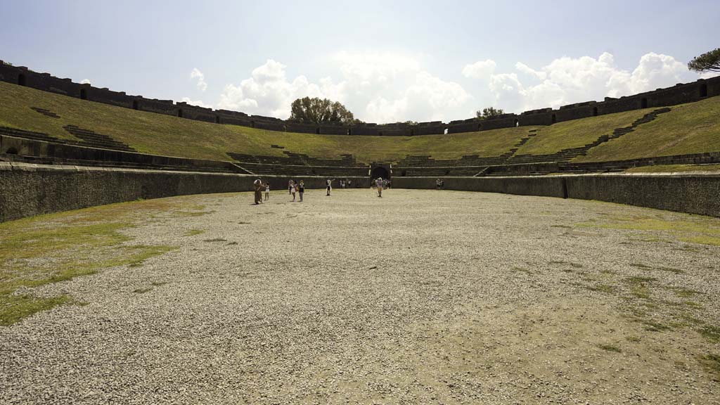 II.6 Pompeii. August 2021. Looking towards south end of arena and seating of amphitheatre. Photo courtesy of Robert Hanson.