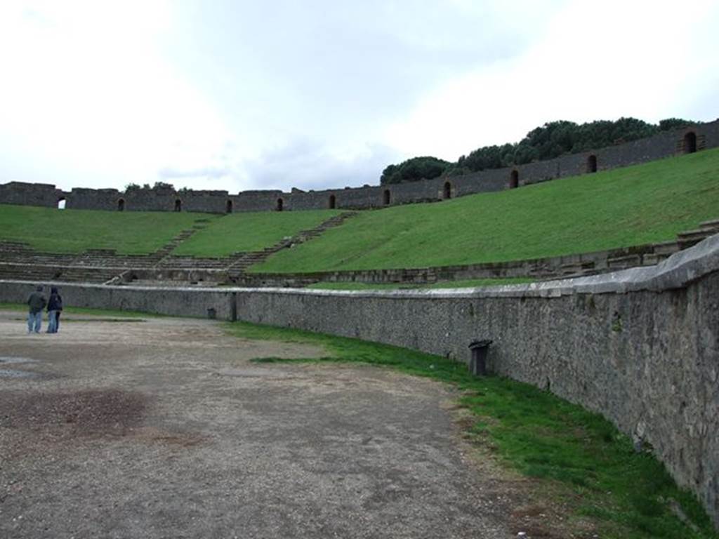 II.6 Pompeii. December 2006. Arena and seating of Amphitheatre, looking south along west side. 