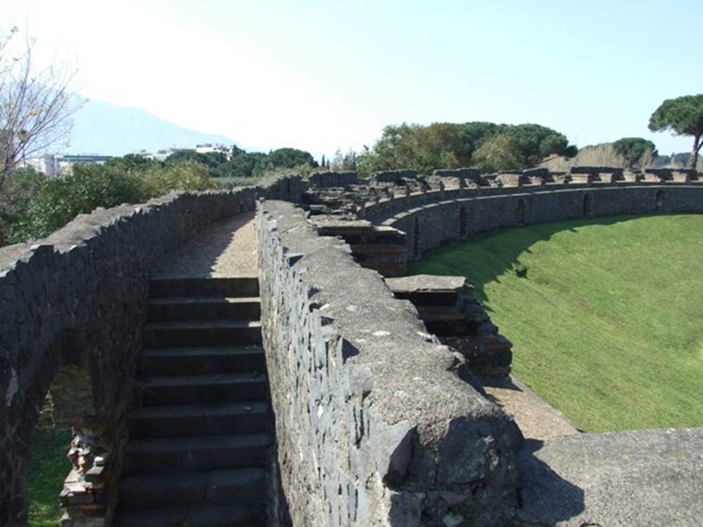 II.6 Pompeii. March 2009. Looking along south-west side of upper level of the Amphitheatre.  