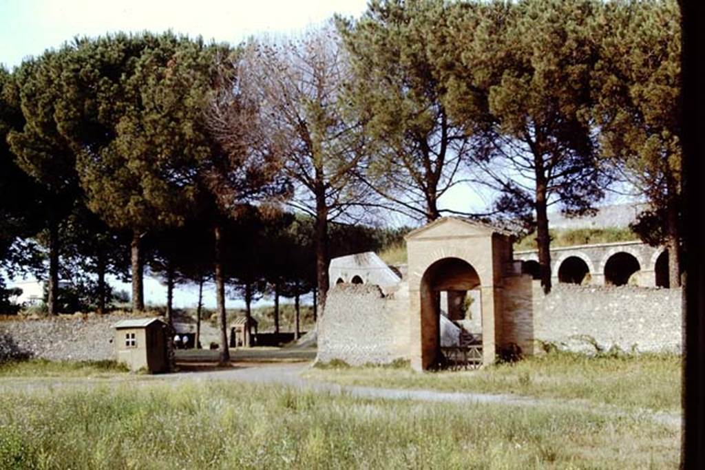 II.7 Pompeii. June 2019. Looking east across pool in Palestra, with entrance doorway at II.7.4. II.7.3 in centre, and II.7.2
Photo courtesy of Buzz Ferebee.
