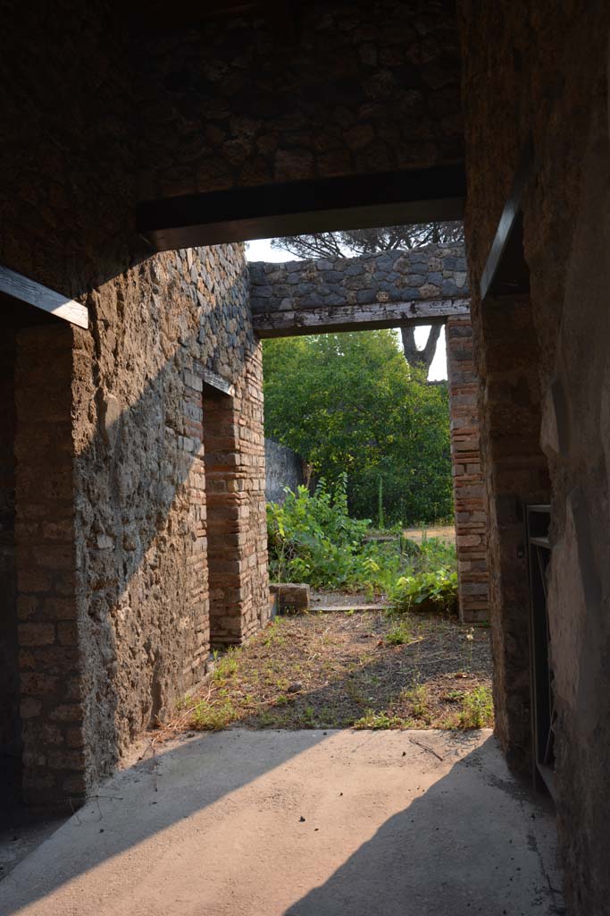 II.8.2/3 Pompeii. July 2017. 
Looking north-east from entrance doorway, with doorway into II.8.3, on left, and room at its rear. 
Foto Annette Haug, ERC Grant 681269 DCOR.
