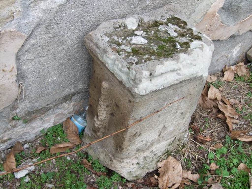 II.8.2 Pompeii. December 2007. Altar with relief of a club, against north wall.